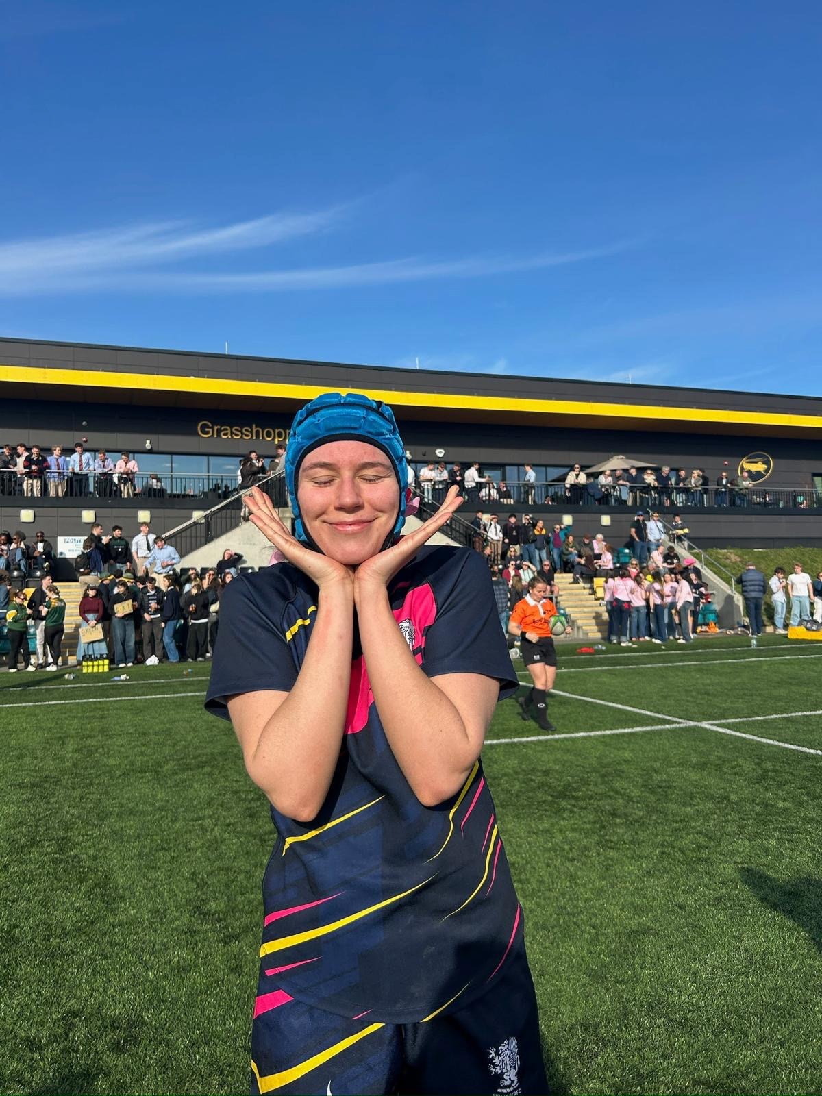 Eliza smiling at rugby