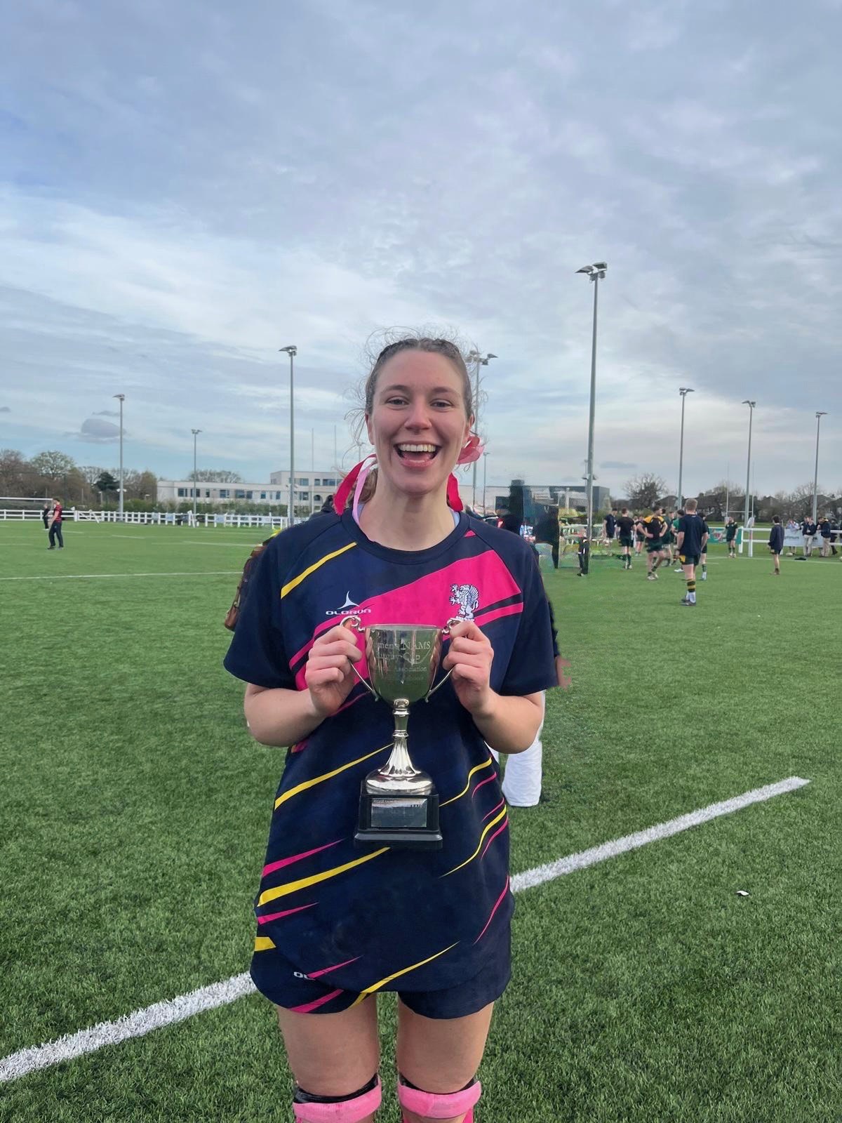 Eliza holding the trophy